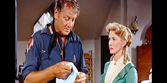 Joel McCrea as John Cord with the woman who was once his girl, Phyllis Coates as Janice, in Cattle Empire (1958)