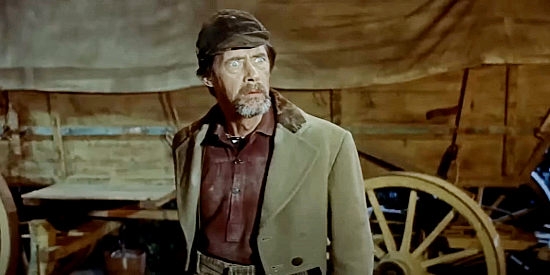 John Carradine as Zachariah Garrison, the man heading West with his apple trees in The Oregon Trail (1959)