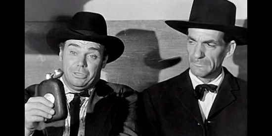 John Doucette as Doc Clawson and Gilman Rankin as Rev. Simon Wheedl, two of the stage passengers endangered by the Cheyenne uprising in Ghost Town (1955)