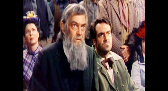 John McIntire as J.C. Hardin and William Pullen as Joe Hardin, attending John Wesley's trial in The Lawless Breed (1953)