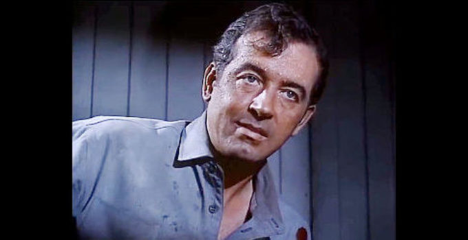 John Payne as Dan Ballard, the man accused of murder and robbery by McCarty in Silver Lode (1954)
