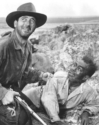 John Payne as Pete Black and Dooley Wilson as Rainbow in Passage West (1951)