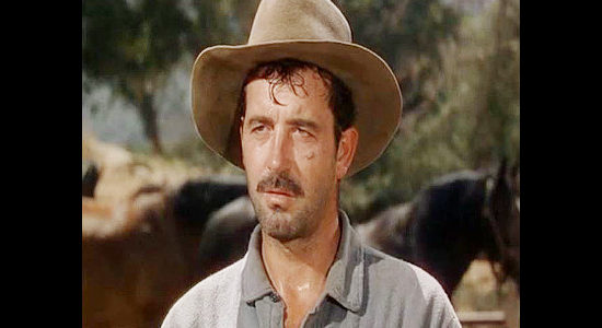 John Payne as Pete Black, the prison escapee who takes over a wagon train and sets a brutal pace to outrun the law in Passage West (1951)