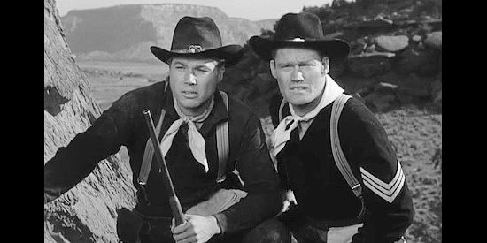 John Smith as Pvt. Reynolds and Chuck Connors as Sgt. Wade McCoy, trying to figure out what the Indians will do next in Tomahawk Trail (1957)