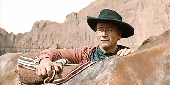 John Wayne as Ethan Edwards, determined to find a captured niece in The Searchers (1956)