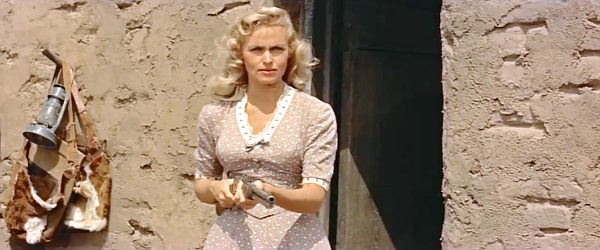 Karen Steele as Mrs. Lane, trying to drive off three strangers at the point of a gun in Ride Lonesome (1959)