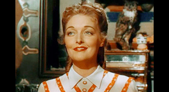 Karin Booth as Frances Harrison, the saloon owner who falls for Jim Redfern in The Cariboo Trail (1950)