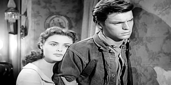 Kathleen Crowley as Kathy Riley and Robert Wagner as Jess Harper mulling an unfortunate turn of events in The Silver Whip (1953)