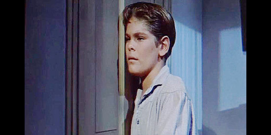 Kim Charney as Stony Warren, ashamed of his father Curt in The Man from God's Country (1958)