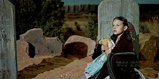 Lana Wood as oung Debbie Edwards, hiding from Indians in the family cemetery in The Searchers (1956)