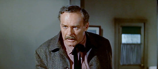 Lane Chandler as the sheriff, trying to hold Mike Davis and a Quantrill man in his jail in Quantrill's Raiders (1958)