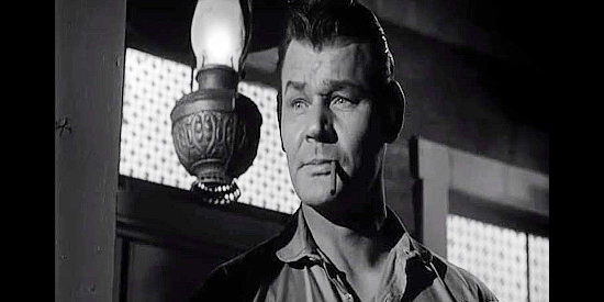 Leo Gordon as Hank Danner, the man who shows up in Santa Rita with his wife Helen in Black Patch (1957)