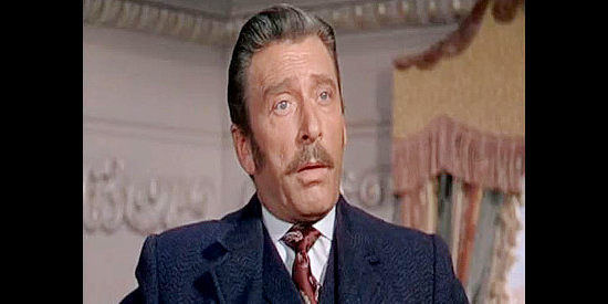 Leon Ames as Chester Graham Sr., the railroad tycoon whose spoiled son winds up on a cattle drive in Cattle Drive (1951)