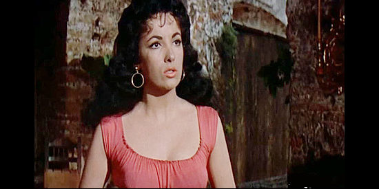 Linda Cristal as Maria O'Reilly, fretting over a threat to Father Jose's safety in The Last of the Fast Guns (1958)