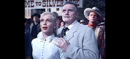 Lizabeth Scott as Rose Evans, fretting over the life of her fiancee with her father (Morris Ankrum as Zachary Evans) by her side in Silver Lode (1954)