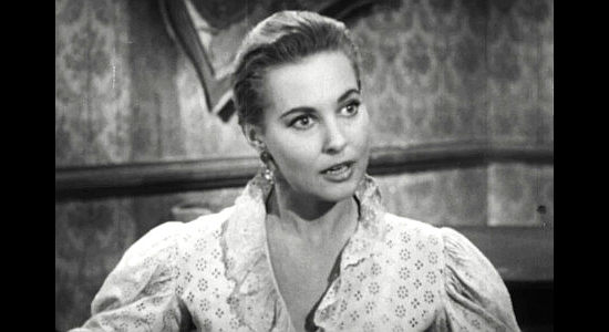 Lola Albright as Julie Wescott, a former saloon girl desperate for a fresh start in Seven Guns to Mesa (1958)