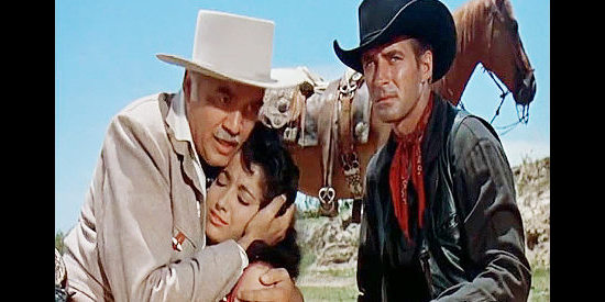 Lorne Greene as King O'Reilly comforts his daughter Maria (Linda Cristal) while Brad Ellison (Jock Mahoney) watches out for a gunman in The Last of the Fast Guns (1958)