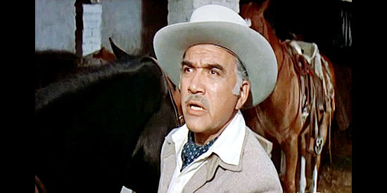 Lorne Greene as King O'Reilly, fretting that his daughter Maria is in danger in The Last of the Fast Guns (1958)