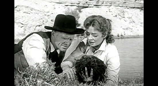 Louis Jean Heydt as Judge Ward Young and Julie Johnson (Arleen Wheelan) with her badly wounded husband in Raiders of Old California (1957)