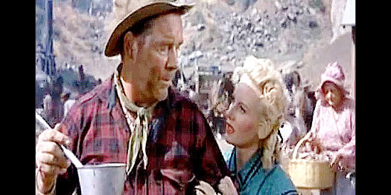 Lucille Norman as Susan Mitchell looking to Hardrock Haggerty (William Haade) for assurance that Jeff can survive a mine cave-in in Carson City (1952)
