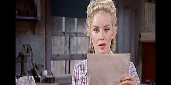 Lucille Norman as Susan Mitchell, surprised by another of her father's fiery editorials in Carson CIty (1952)