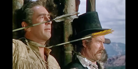 Macdonald Carey as Jim Bowie and Will Geer as Dan'l Seeger, tired up and facing a horde of angry Comanche in Comanche Territory (1950)