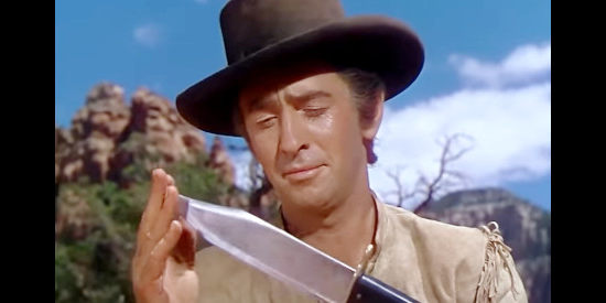 Macdonald Carey as Jim Bowie, showing off his famous Bowie Knife in Comanche Territory (1950)