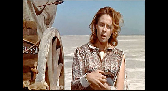 Mala Powers as Sue Russell, so lost in the desert she doesn't realize she's returned to her own wagon in Sierra Baron (1958)