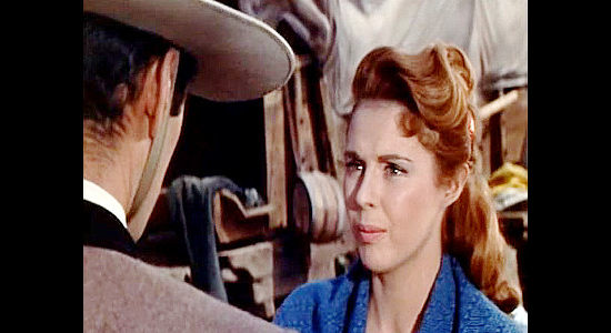 Mala Powers as Sue Russell, trying to explain the dream of owning land out West to Miguel Delmonte in Sierra Baron (1958)