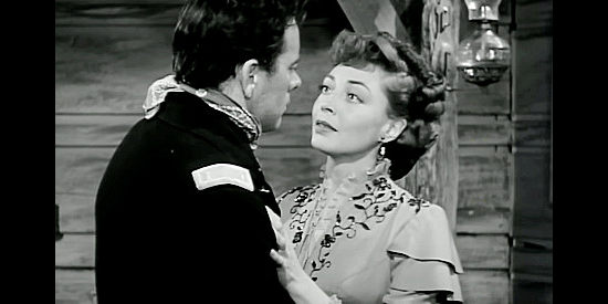 Marie Windsor as Celie Donlin, cuddling up to Lt. Haywood as her ticket back East in Little Big Horn (1951)