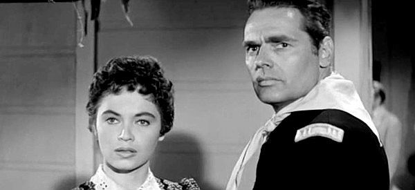 Marilyn Saris as Lynn Sutter and Walter Reed as Capt. Ellis North, spotting smoke in the distance in The Lawless Eighties (1957)