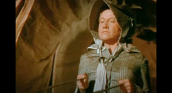 Mary Kent as Mrs. Winters, the woman who takes Jim Redfern on as a partner in the cattle business in The Cariboo Trail (1950)