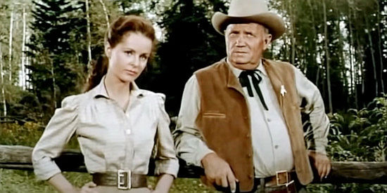 Mary Murphy as Lucy Lee and Walter Sands as the sheriff, wondering who they can count on in The Maverick Queen (1956)