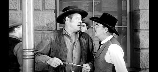 Max Bauer as Gus Ortmann, being ordered by Russ Nevers (Ray Teal) to use his fists to rid Red Creek of Utah Blaine in Utah Blaine (1957)