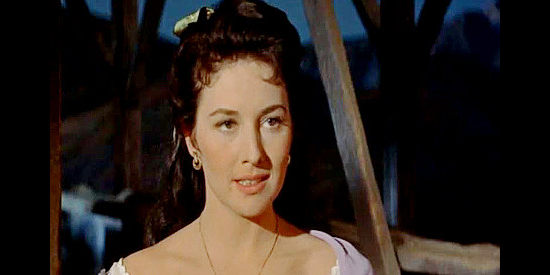 May Wynn as Caroline Vail, a woman who views her engagement to John Parrish as a ticket back East in The Violent Men (1955)