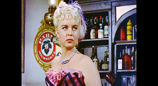 Meg Randall as Lila, the saloon girl who helps Dan Barton and Roberts connect in Gallatin in Last of the Badmen (1957)