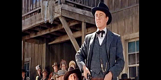 Merv Griffin as Steve, a Turlock employee about to give the signal to start an election day horse race in Bluerock in The Boy from Oklahoma (1954)