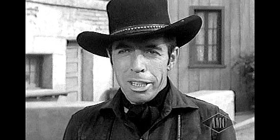 Michael Pate as Drake Robey, the mysterious dressed-all-in-black gunman in Curse of the Undead (1959)