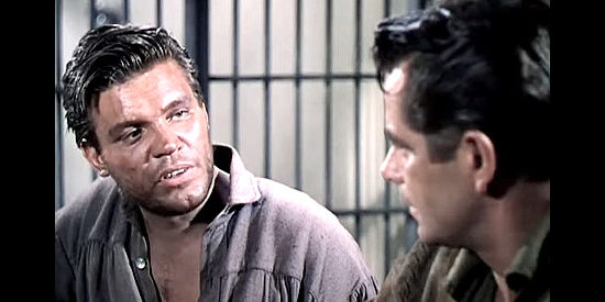 Neville Brand as Dawes, trying to convince John Stroud to join Jess Wade's gang in The Man from the Alamo (1953)