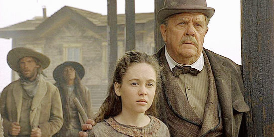 Olivia Burnette as Katie with Pat Hingle as Horace, watching one of the gunfights in The Quick and the Dead (1995)