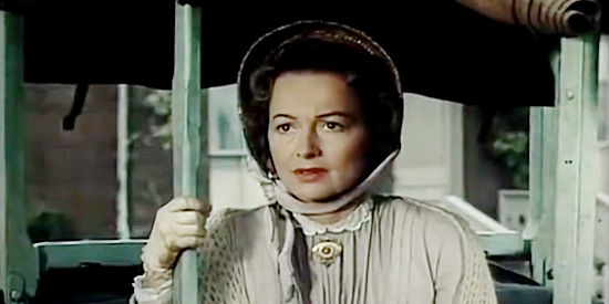 Olivia de Havilland as Linnett Moore, the woman who opens her home to John and David Chandler in The Proud Rebel (1958))