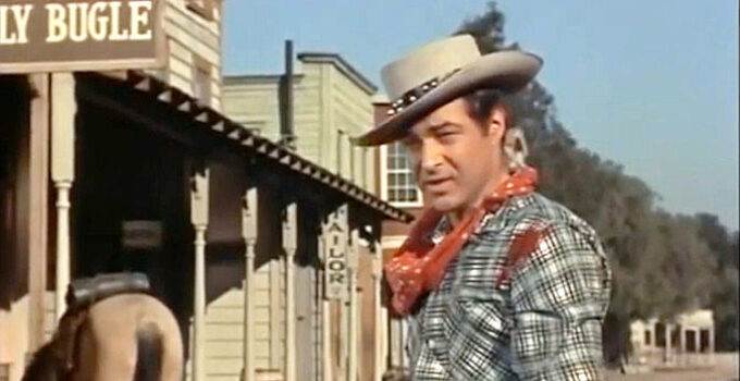 Anthony Dexter as Billy the Kid, wounded but still standing after reluctantly strapping on his six-gun again in The Parson and the Outlaw (1957)