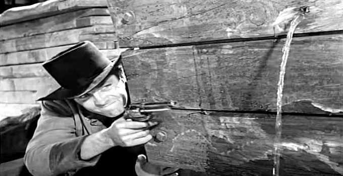 Dale Robertson as Race Crim when an outlaw gang strikes the stage in The Silver Whip (1953)