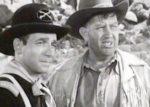 Dane Clark as Capt. Dave Storm and Andy Devine as Injun, weighing their options in Thunder Pass (1954)