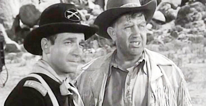 Dane Clark as Capt. Dave Storm and Andy Devine as Injun, weighing their options in Thunder Pass (1954)