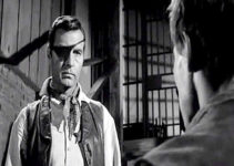 George Montgomery as Clay Morgan, confronted with an angry young man who once wanted to be his deputy in Black Patch (1957)