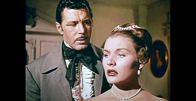 James Craig as Clay Clayburn as Barbara Payton as Kathy Summers in Drums in the Deep South (1951)