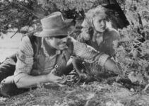 John Agar as Jeff Donner and Penny Edwards as Susan Crowley in Ride a Violent Miles (1957)