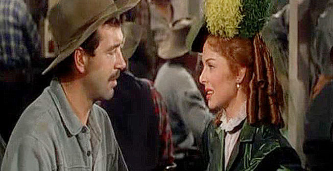 John Payne as Pete Black and Arleen Whelan as Rose Billings in Passage West (1951)