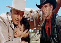 Lorne Greene as King O'Reilly comforts his daughter Maria (Linda Cristal) while Brad Ellison (Jock Mahoney) watches out for a gunman in The Last of the Fast Guns (1958)